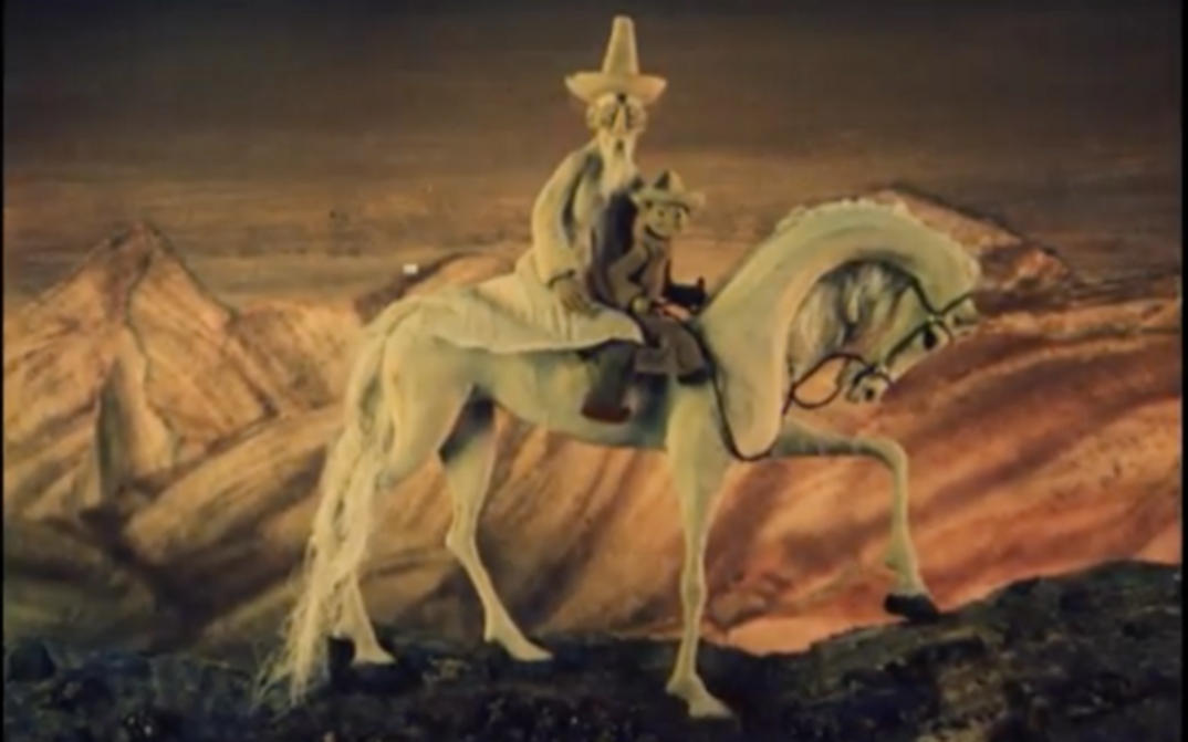 Film still from the animated film TOLUBAY: An old man and a child sit on a white horse.