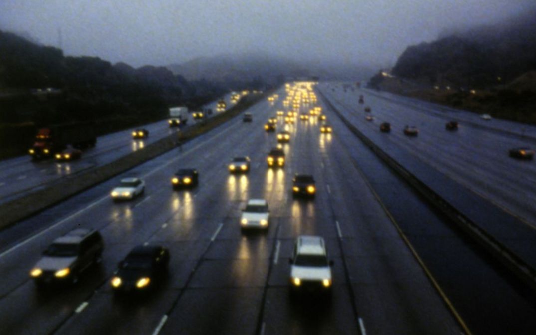 Film still from LOS: A multi-lane road in Los Angeles.