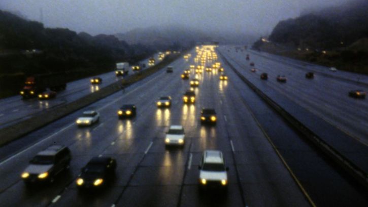 Film still from LOS: A multi-lane road in Los Angeles.