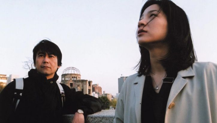 Film still from A LETTER FROM HIROSHIMA: A man and a woman on a city tour.