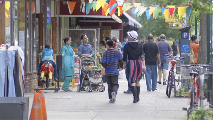 Film still from IN JACKSON HEIGHTS. People on the street in New York City