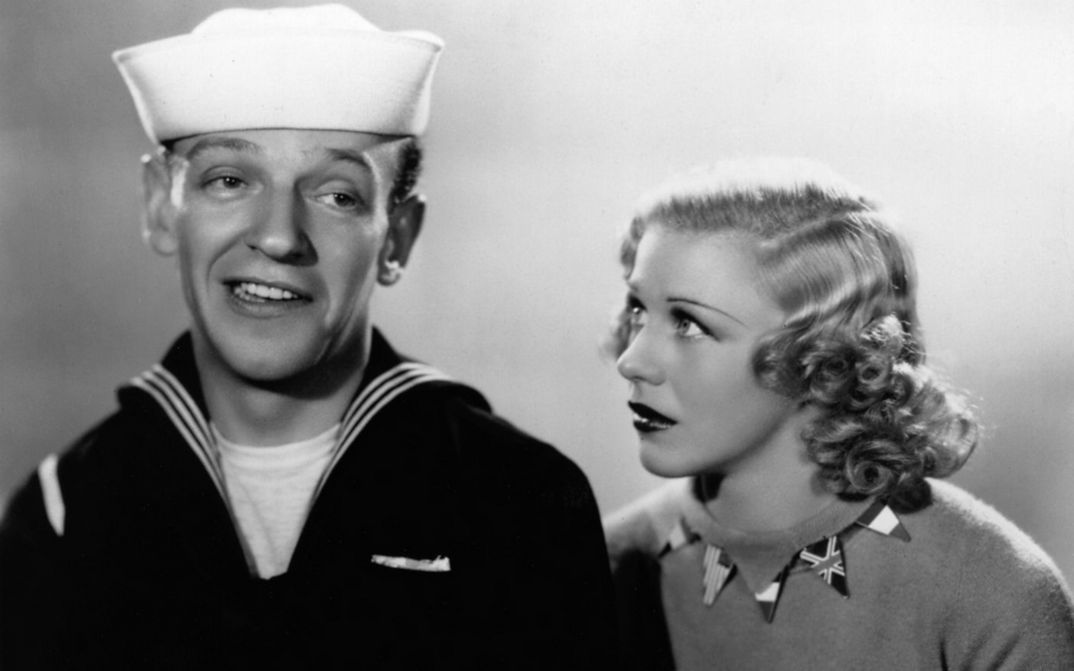 Filmstill from FOLLOW THE FLEET. Fred Astaire is wearing a sailor suit, Ginger Rogers is looking at him.