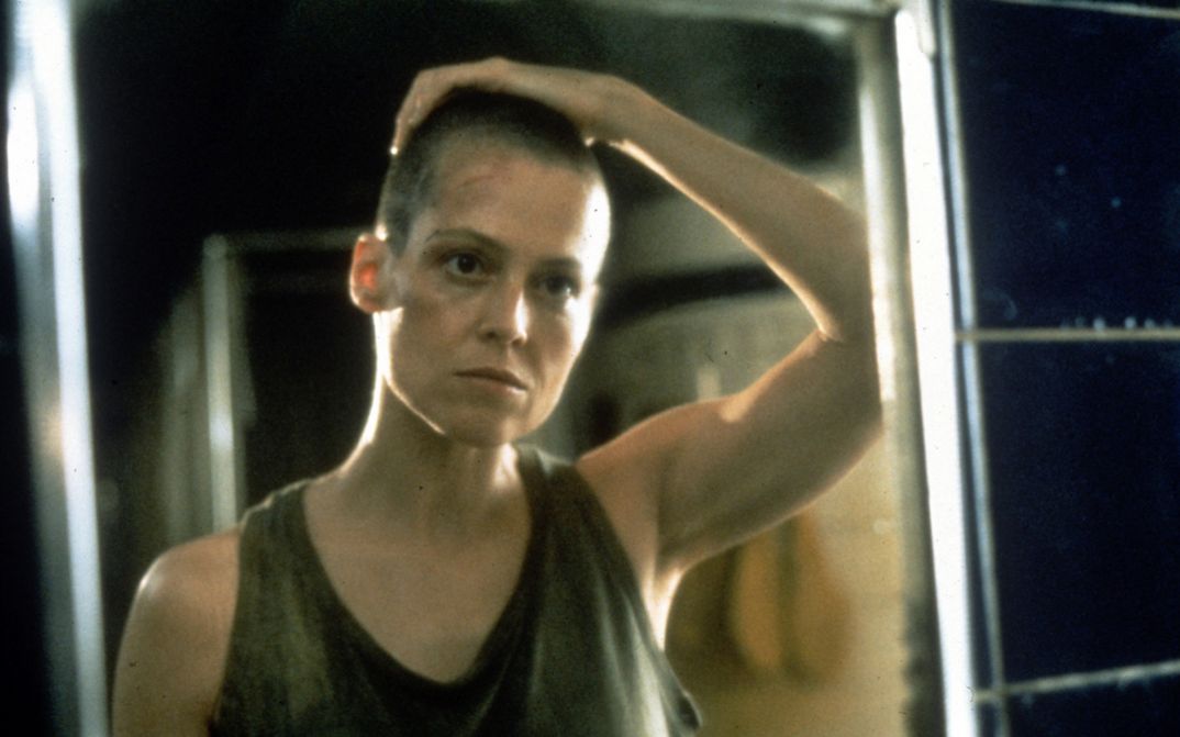 Film still from ALIEN. Sigourney Weaver as Lieutenant Ripley looks into a mirror.